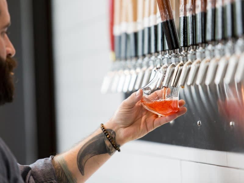 A sour ale being poured from the Wood Shop tap wall